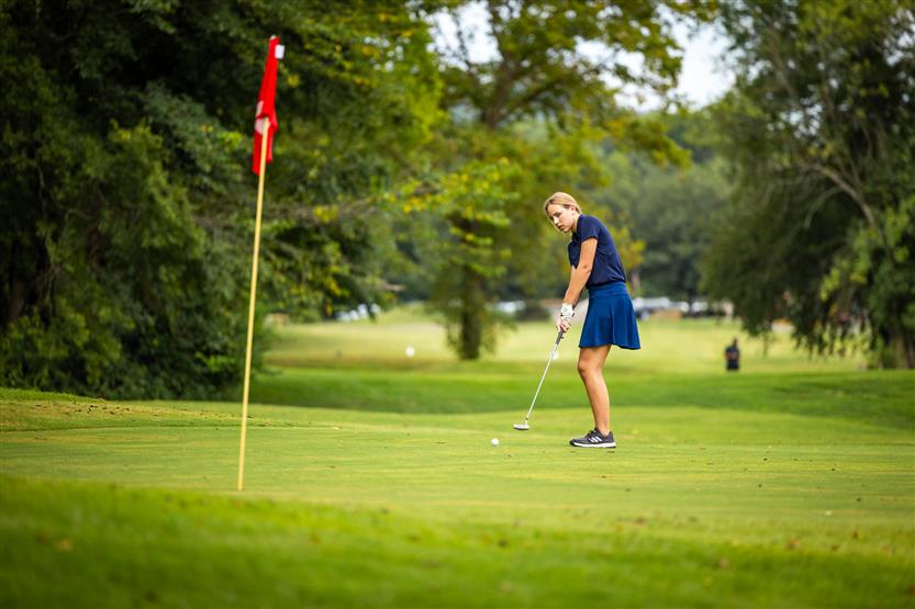 Students play golf